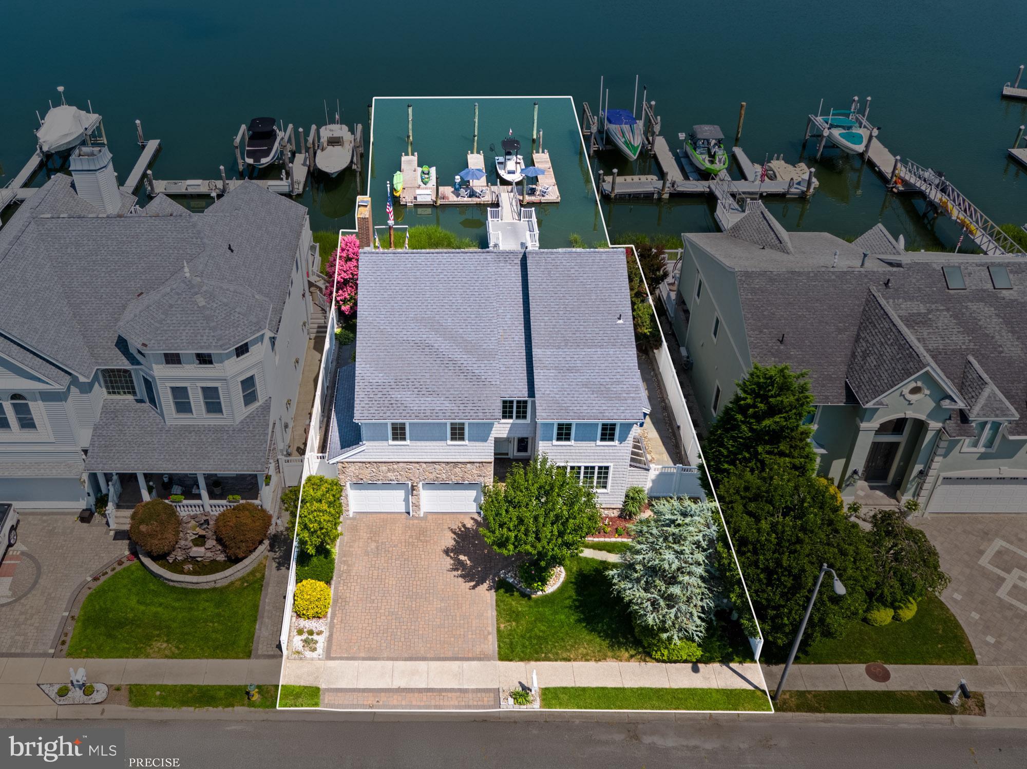 87 Lagoon Boulevard Brigantine, NJ 08203 - Photo 6 of 66 an aerial view of a house with garden space and street view