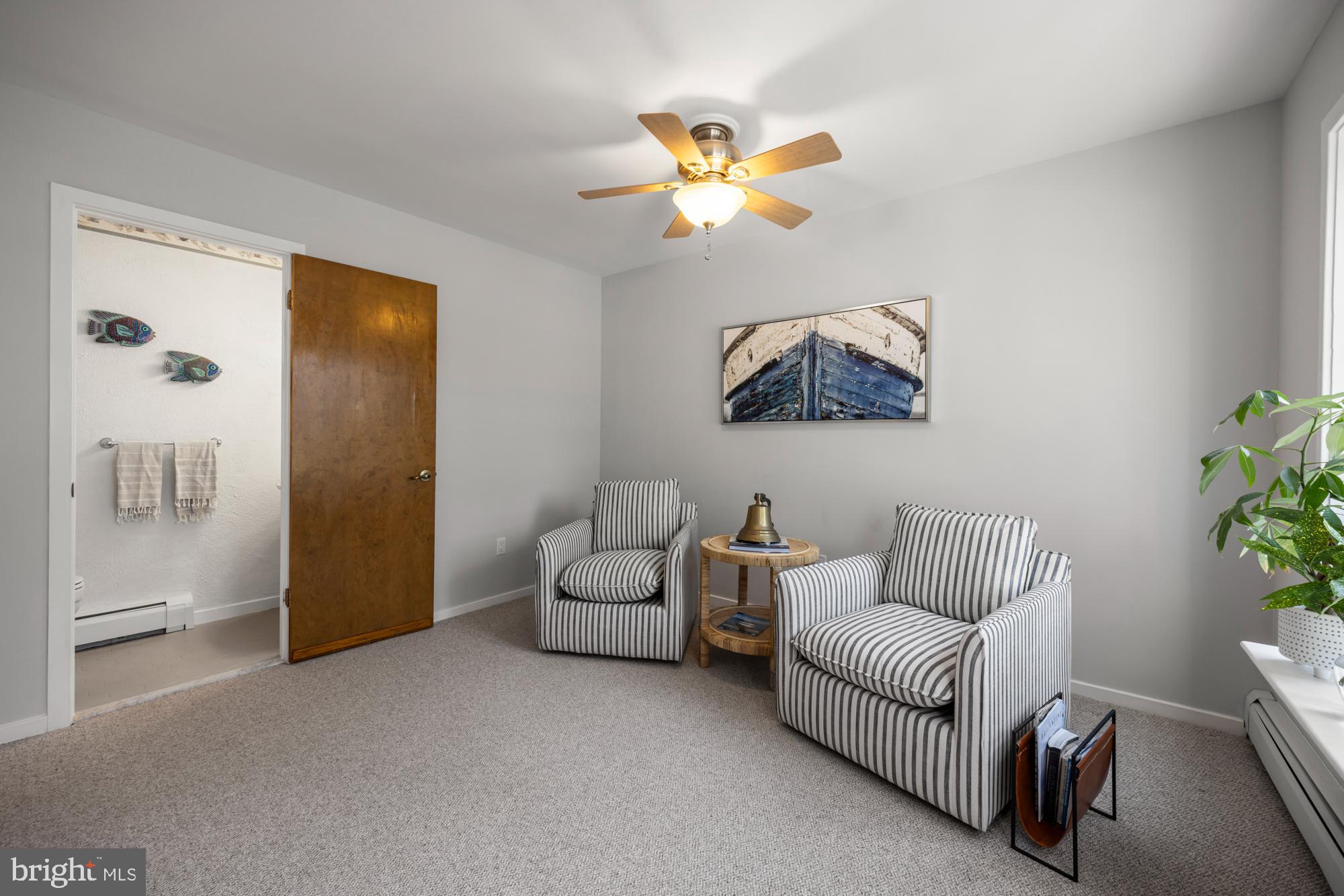 87 Lagoon Boulevard Brigantine, NJ 08203 - Photo 10 of 66 a living room with furniture and a potted plant
