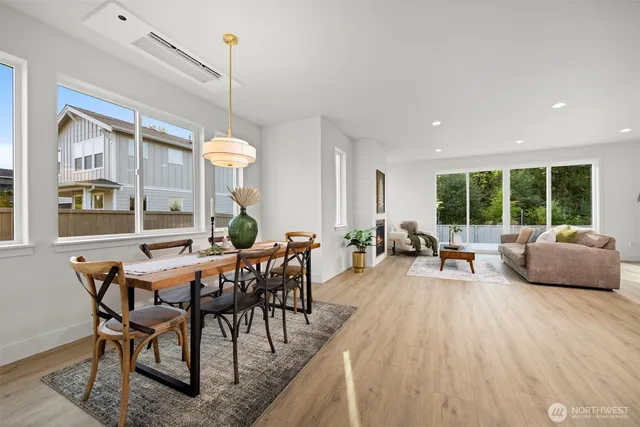 a view of a dining room with furniture window and outside view