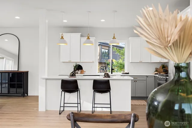 a kitchen with a sink cabinets and window