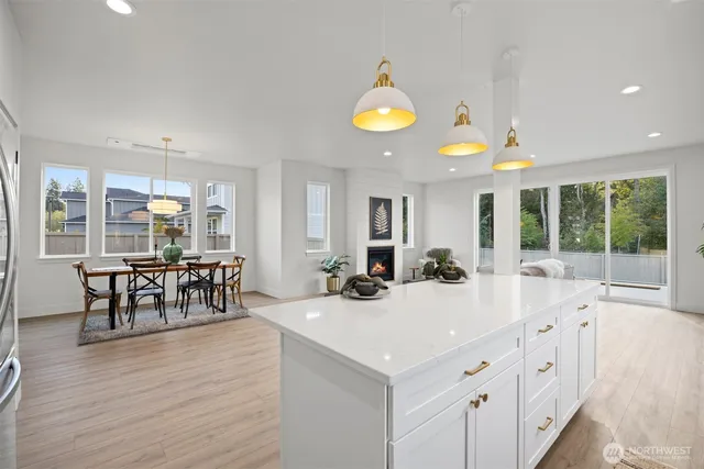 a view of a kitchen and dining room