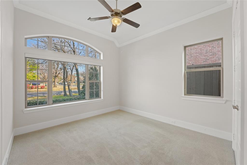 4026 North Cresthaven Road Dallas, TX 75209 - Photo 15 of 22 an empty room with windows and fan