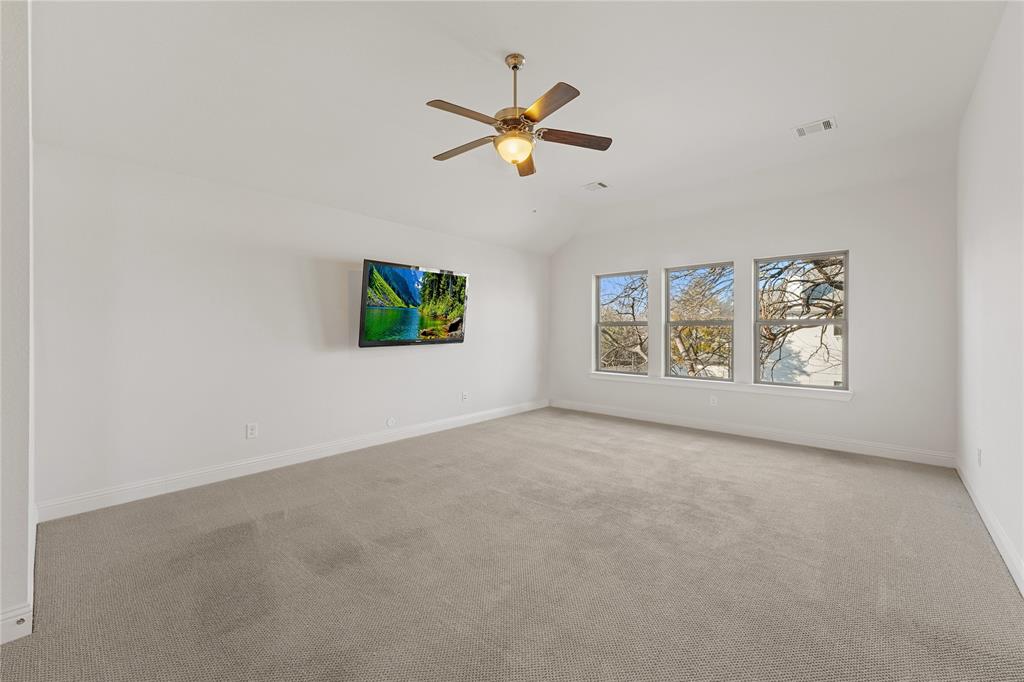 4026 North Cresthaven Road Dallas, TX 75209 - Photo 17 of 22 an empty room with windows and ceiling fan view