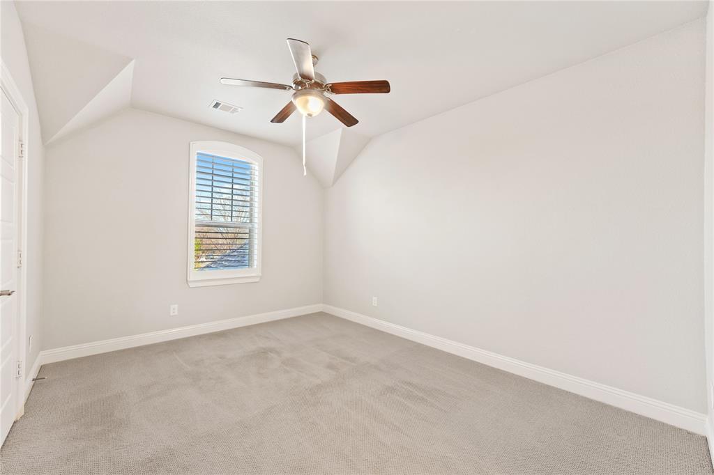 4026 North Cresthaven Road Dallas, TX 75209 - Photo 19 of 22 an empty room with windows and fan