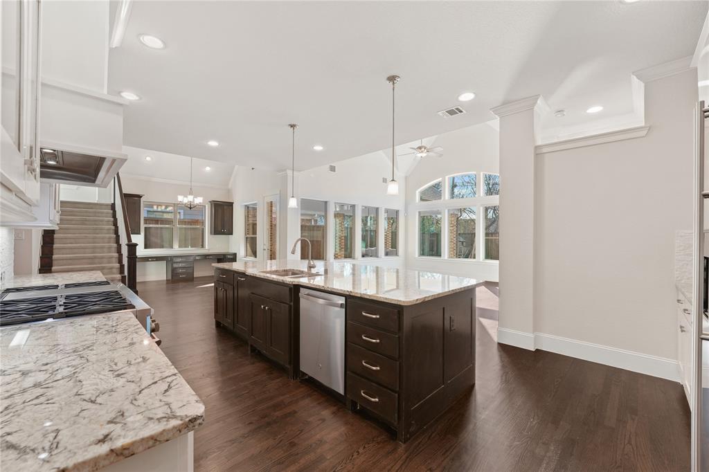 4026 North Cresthaven Road Dallas, TX 75209 - Photo 3 of 22 a large kitchen with stainless steel appliances kitchen island granite countertop a large counter top and stove