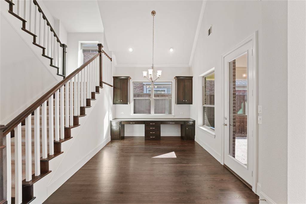 4026 North Cresthaven Road Dallas, TX 75209 - Photo 6 of 22 a view of staircase and kitchen with wooden floor