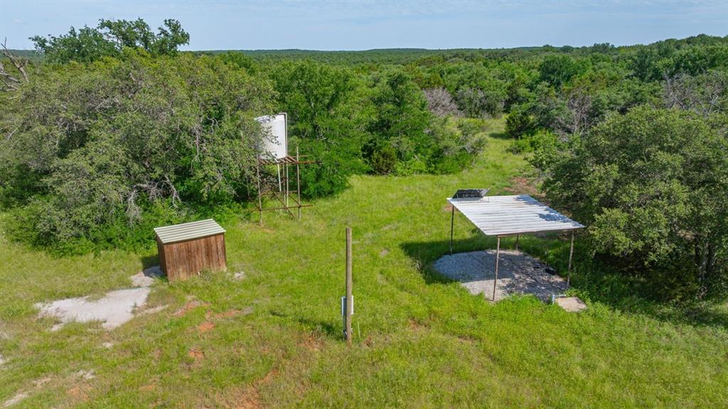 136 Moose Trail Ranger, TX 76470 - Photo 17 of 40 a backyard of a house with table and chairs