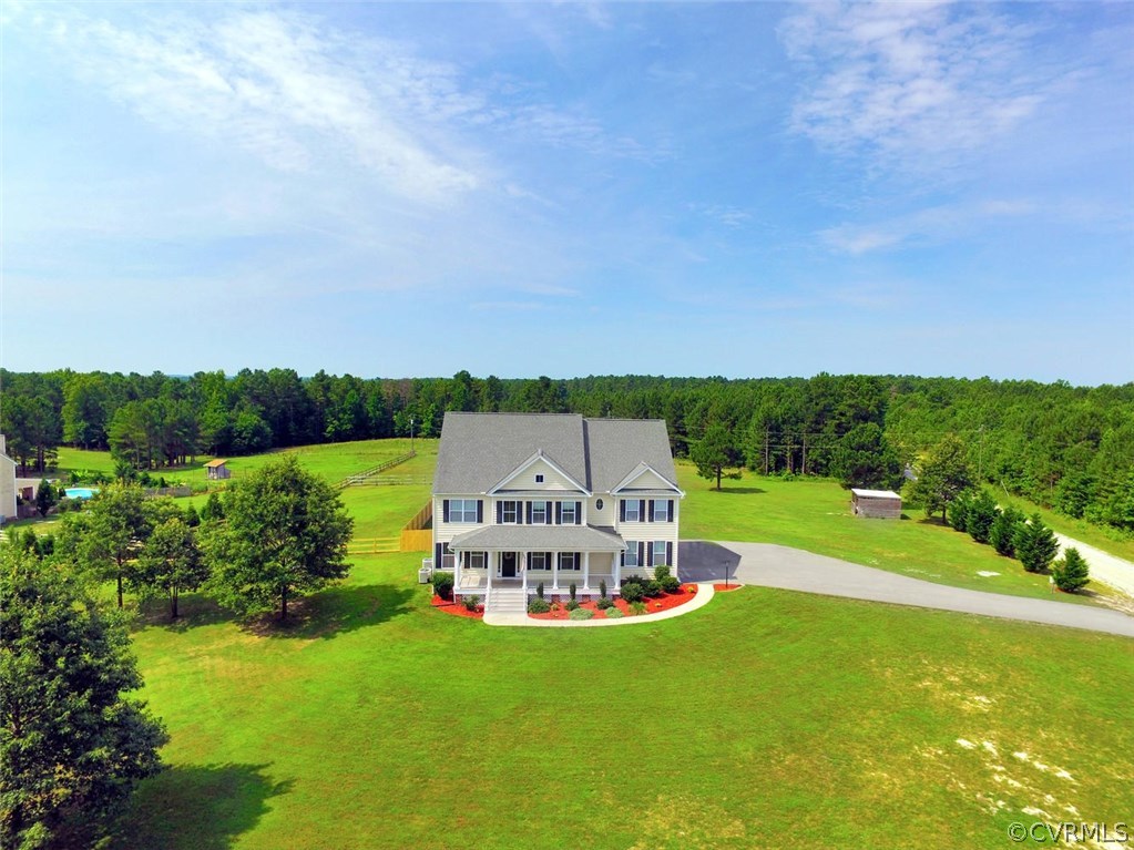 8910 Beaver Bridge Road Moseley, VA 23120 - Photo 1 of 44 a view of a lake with houses in the back