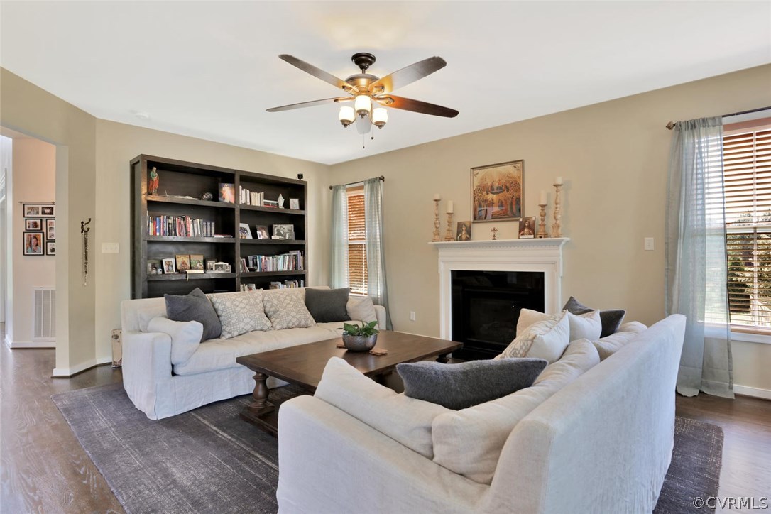 8910 Beaver Bridge Road Moseley, VA 23120 - Photo 16 of 44 a living room with furniture and a fireplace