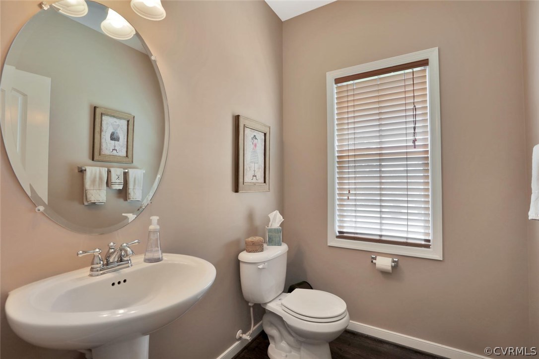 8910 Beaver Bridge Road Moseley, VA 23120 - Photo 18 of 44 a bathroom with a sink a toilet and a mirror