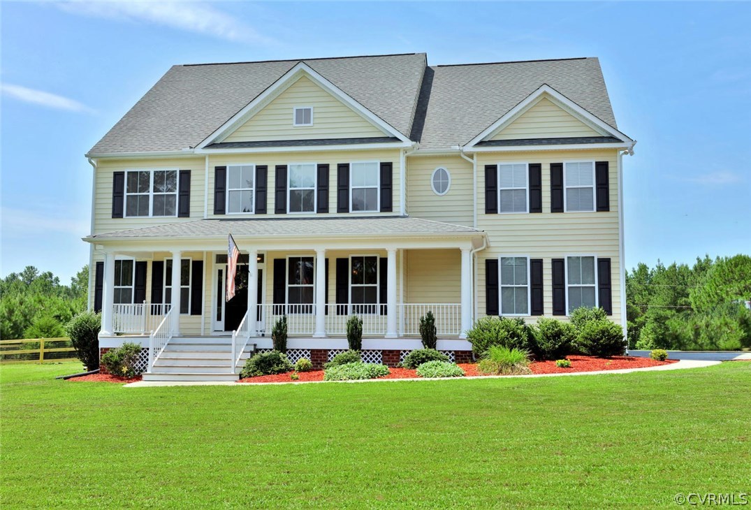 8910 Beaver Bridge Road Moseley, VA 23120 - Photo 2 of 44 a front view of a house with a yard and trees