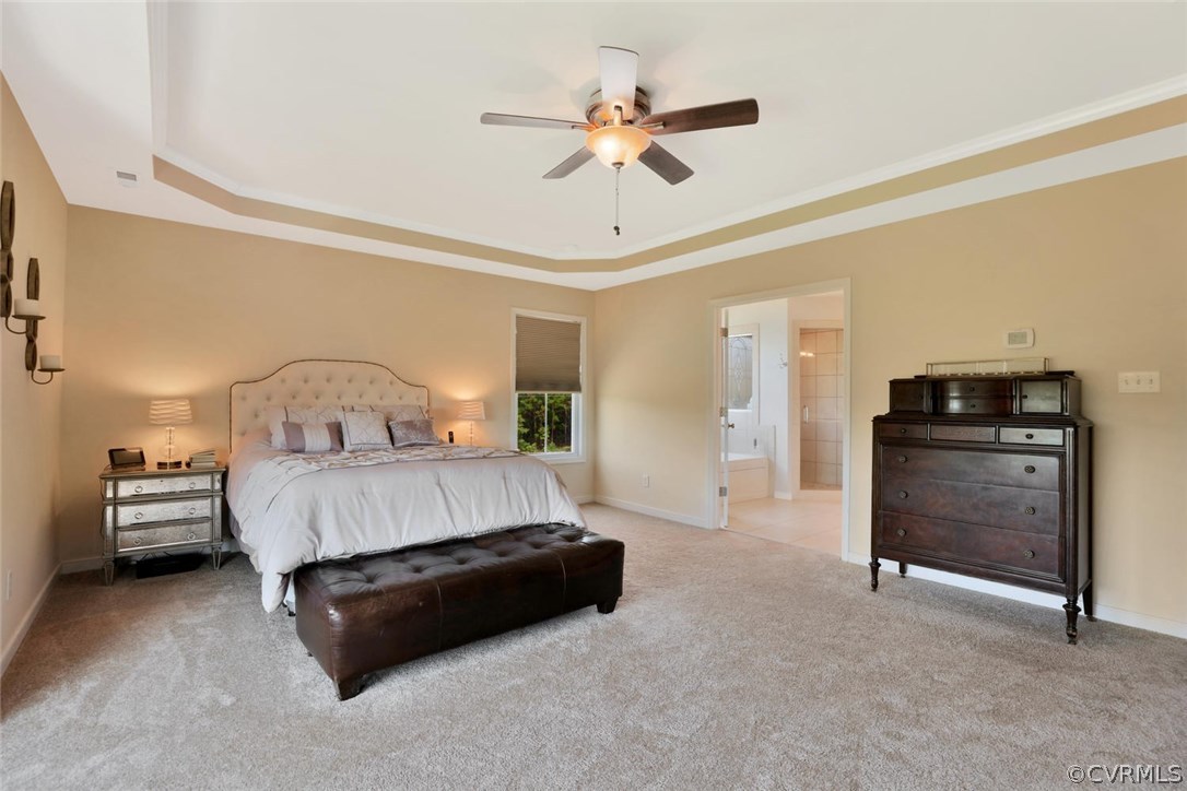 8910 Beaver Bridge Road Moseley, VA 23120 - Photo 21 of 44 a bed room with a bed and a ceiling fan
