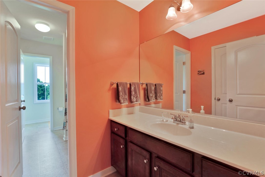 8910 Beaver Bridge Road Moseley, VA 23120 - Photo 27 of 44 a bathroom with a sink double vanity and a mirror