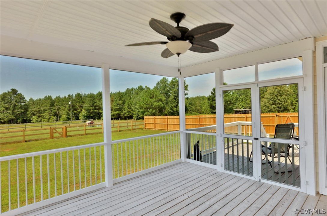 8910 Beaver Bridge Road Moseley, VA 23120 - Photo 35 of 44 a view of a balcony with table and chairs