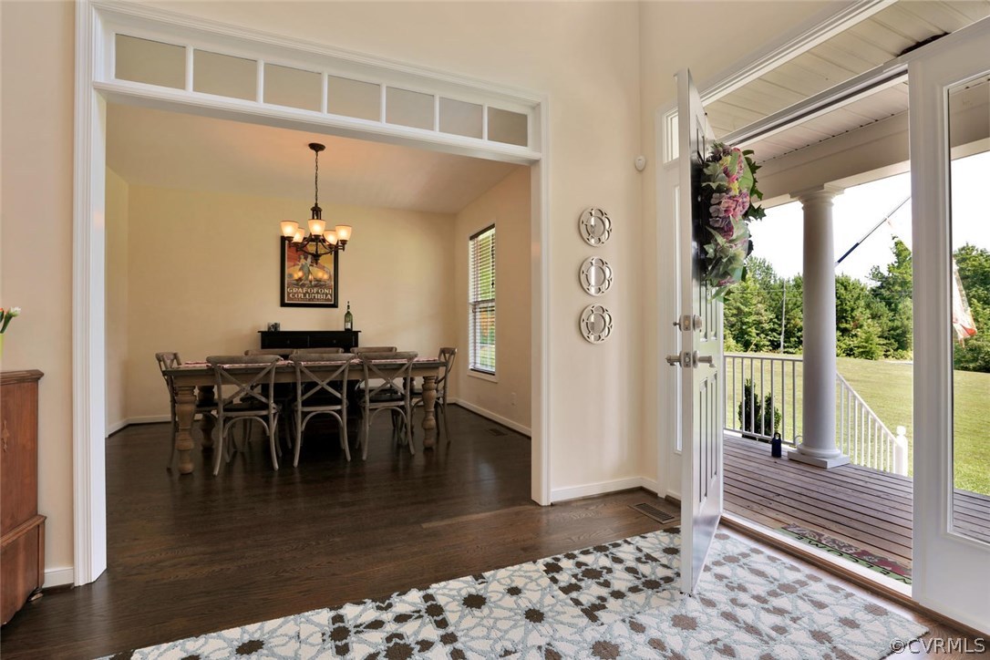 8910 Beaver Bridge Road Moseley, VA 23120 - Photo 5 of 44 a view of a dining room with furniture window and wooden floor