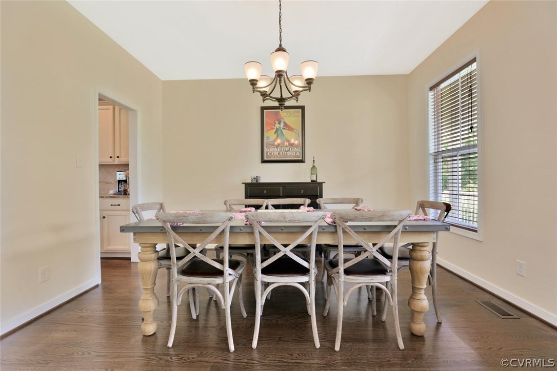 8910 Beaver Bridge Road Moseley, VA 23120 - Photo 7 of 44 a dining room with furniture window and wooden floor