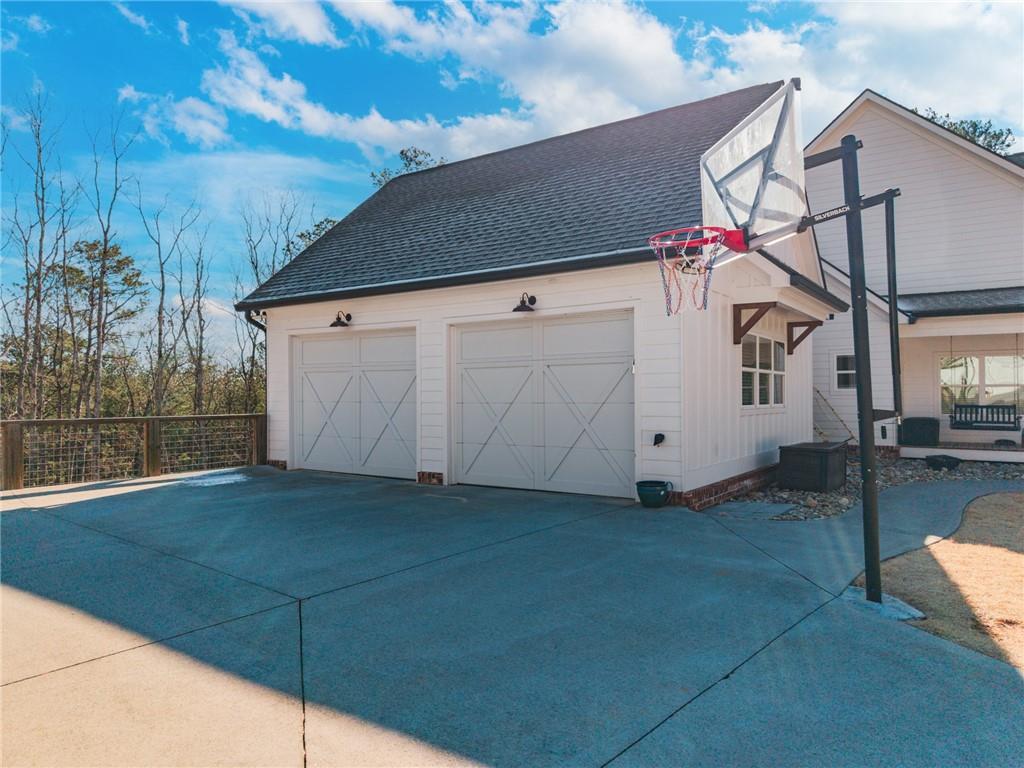 2250 Sperin Road Ball Ground, GA 30107 - Photo 49 of 56 a view of a house with a garage