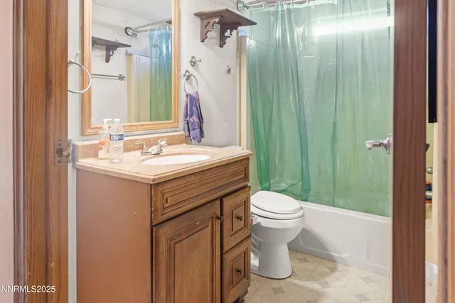 a view of a bedroom with closet and window