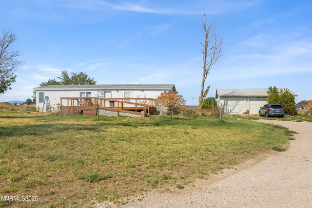 a view of a swimming pool with a yard