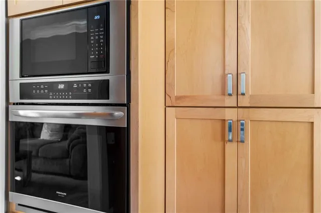 a view of fireplace and microwave