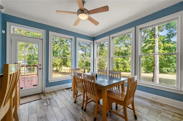 a view of a dining room with furniture window and wooden floor