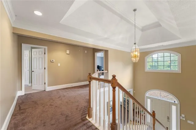 a view of a hallway with a chandelier