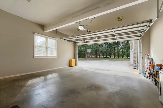 a view of empty room with windows and air conditioner