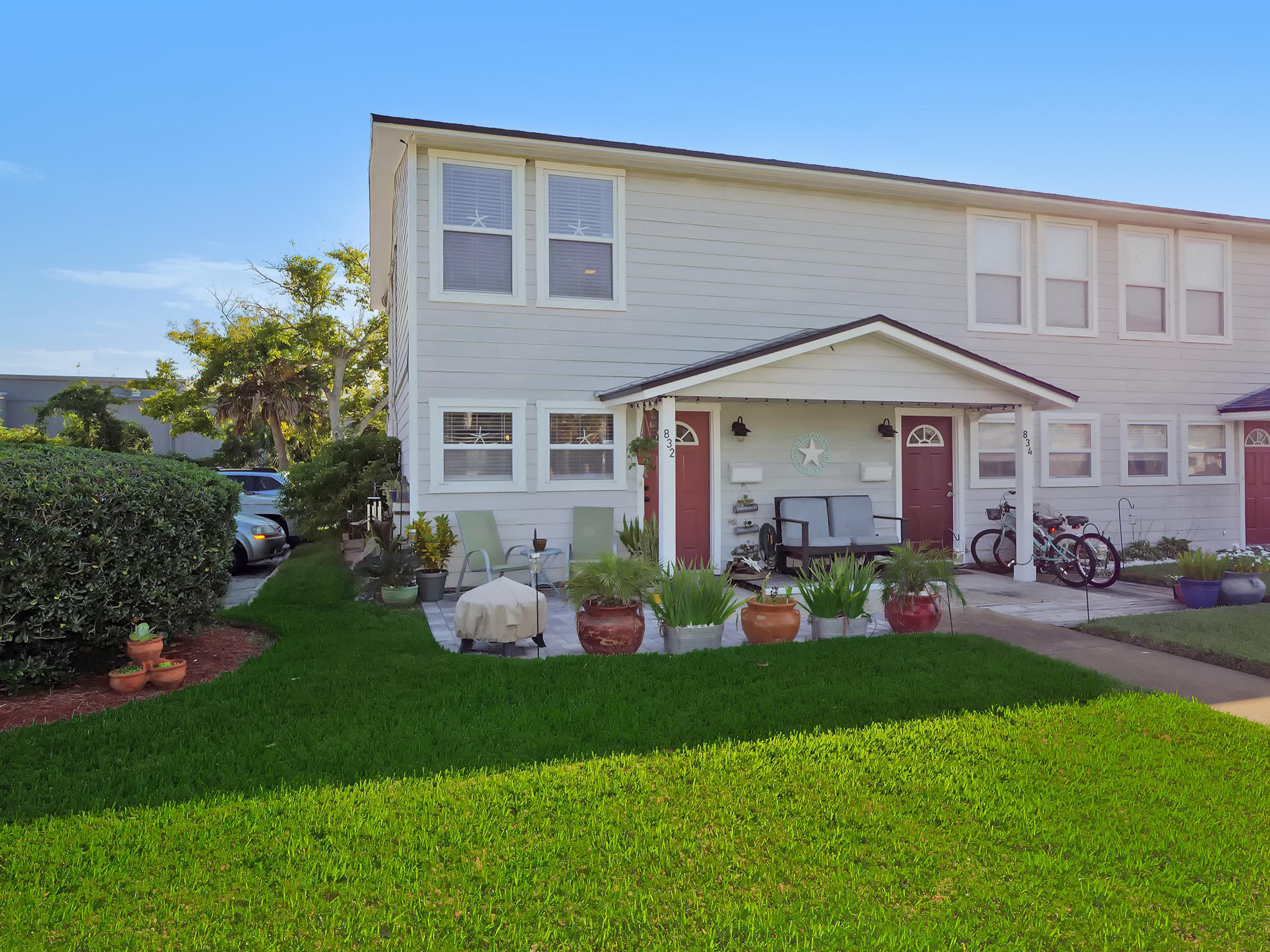 832 Cavalla Road Atlantic Beach, FL 32233 - Photo 1 of 34 a front view of a house with garden