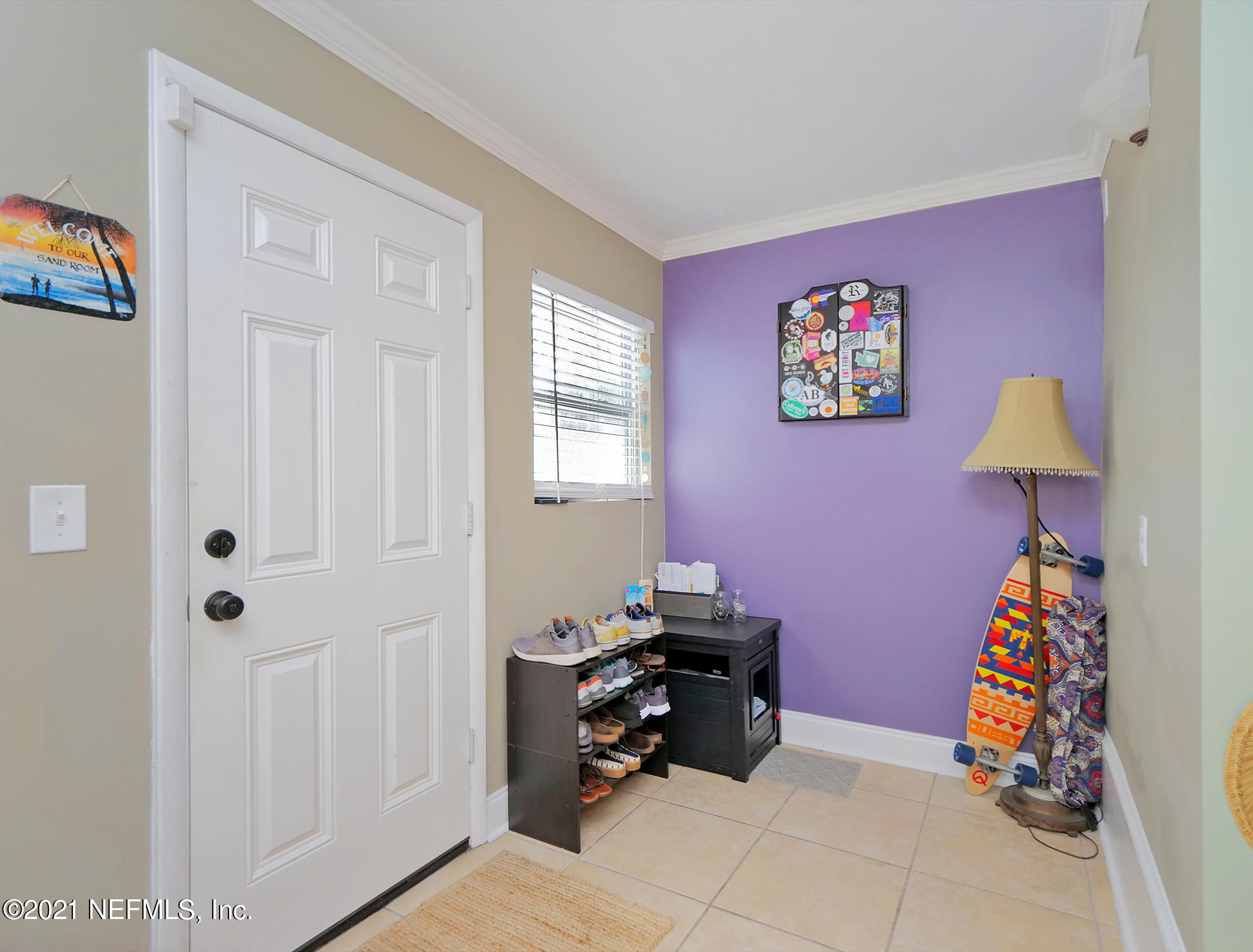 832 Cavalla Road Atlantic Beach, FL 32233 - Photo 13 of 34 a room with furniture a rug and a window