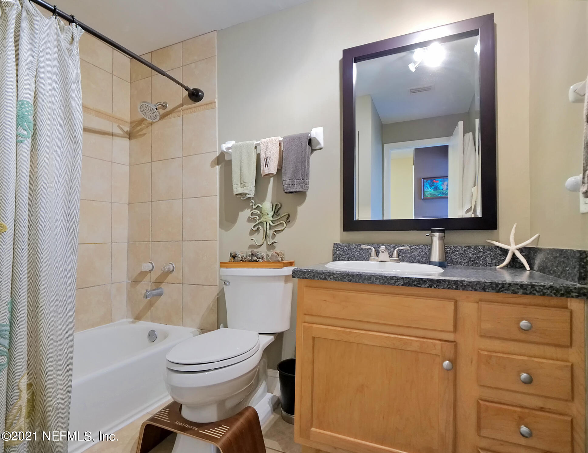 832 Cavalla Road Atlantic Beach, FL 32233 - Photo 18 of 34 a bathroom with a toilet sink and mirror