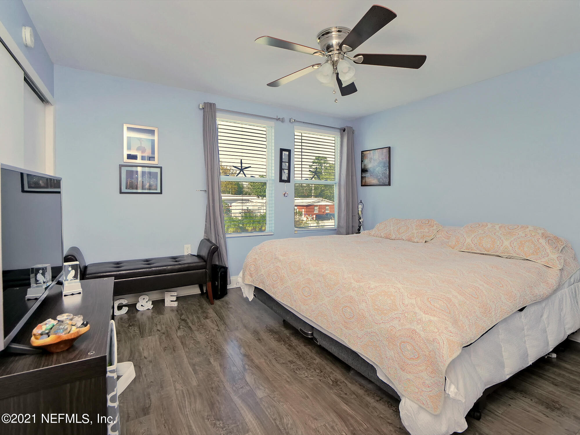 832 Cavalla Road Atlantic Beach, FL 32233 - Photo 19 of 34 a bed sitting in a bedroom next to a window