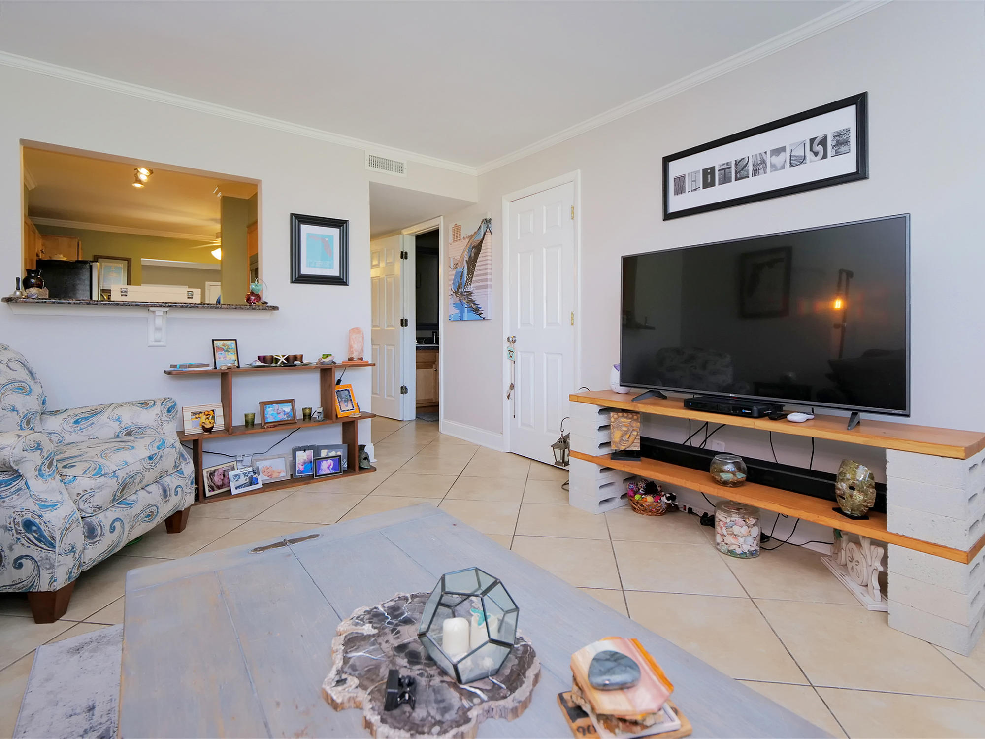832 Cavalla Road Atlantic Beach, FL 32233 - Photo 5 of 34 a living room with furniture and a flat screen tv