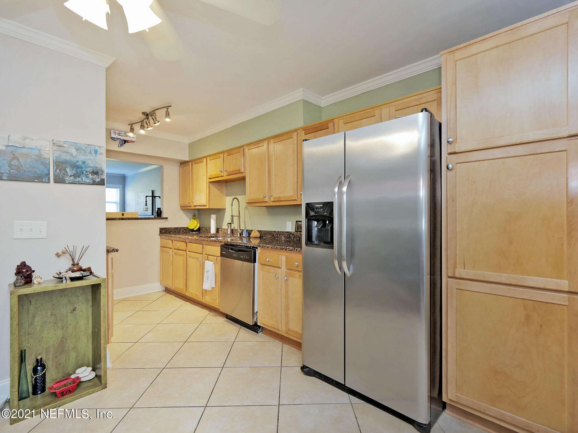 832 Cavalla Road Atlantic Beach, FL 32233 - Photo 8 of 34 a kitchen with stainless steel appliances a refrigerator sink and cabinets