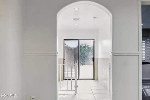 a view of a glass door and a window