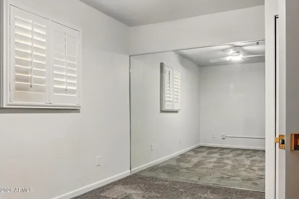 a view of empty room with windows