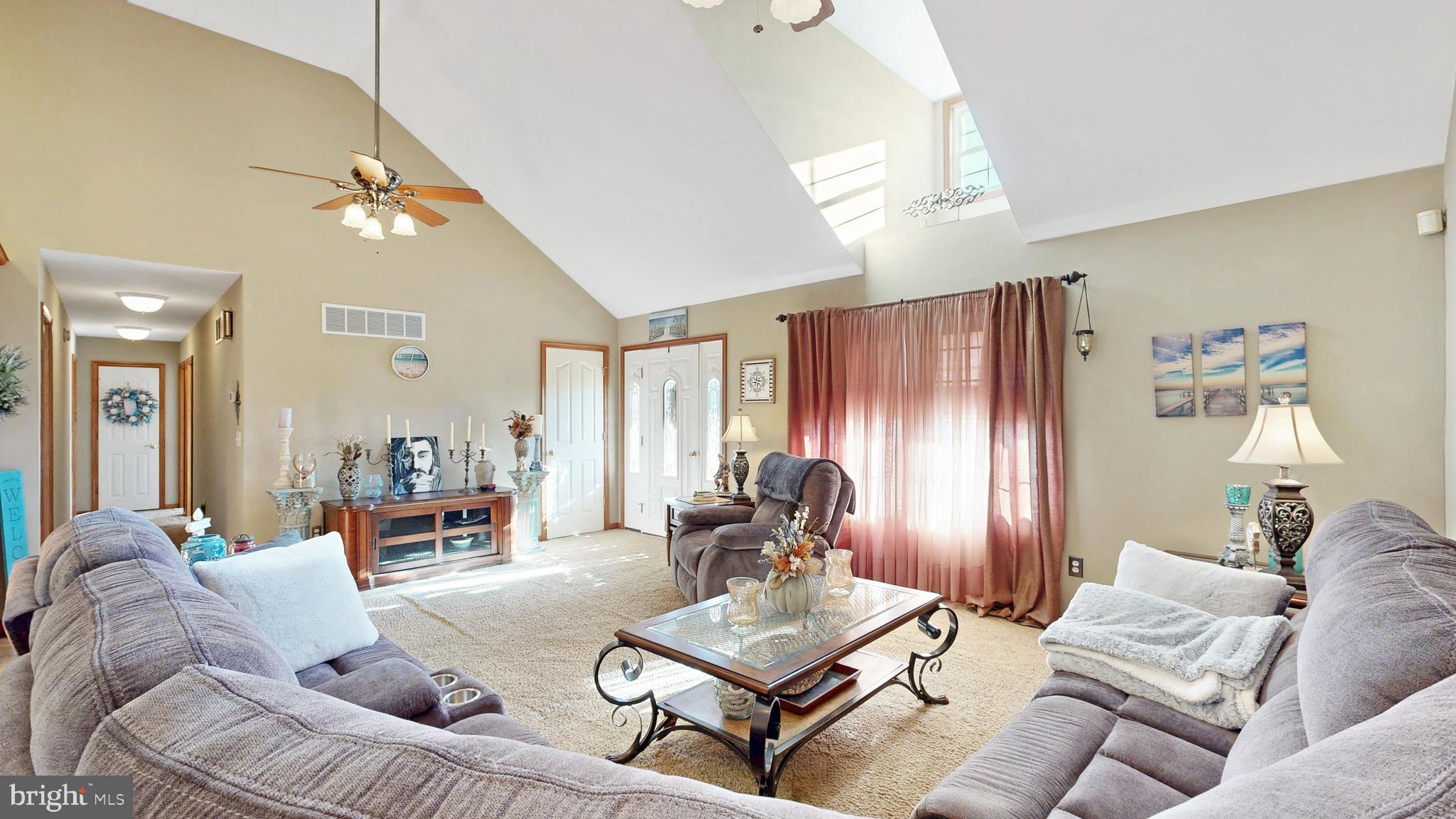 11872 Shawnee Road Greenwood, DE 19950 - Photo 26 of 55 a living room with furniture and a chandelier