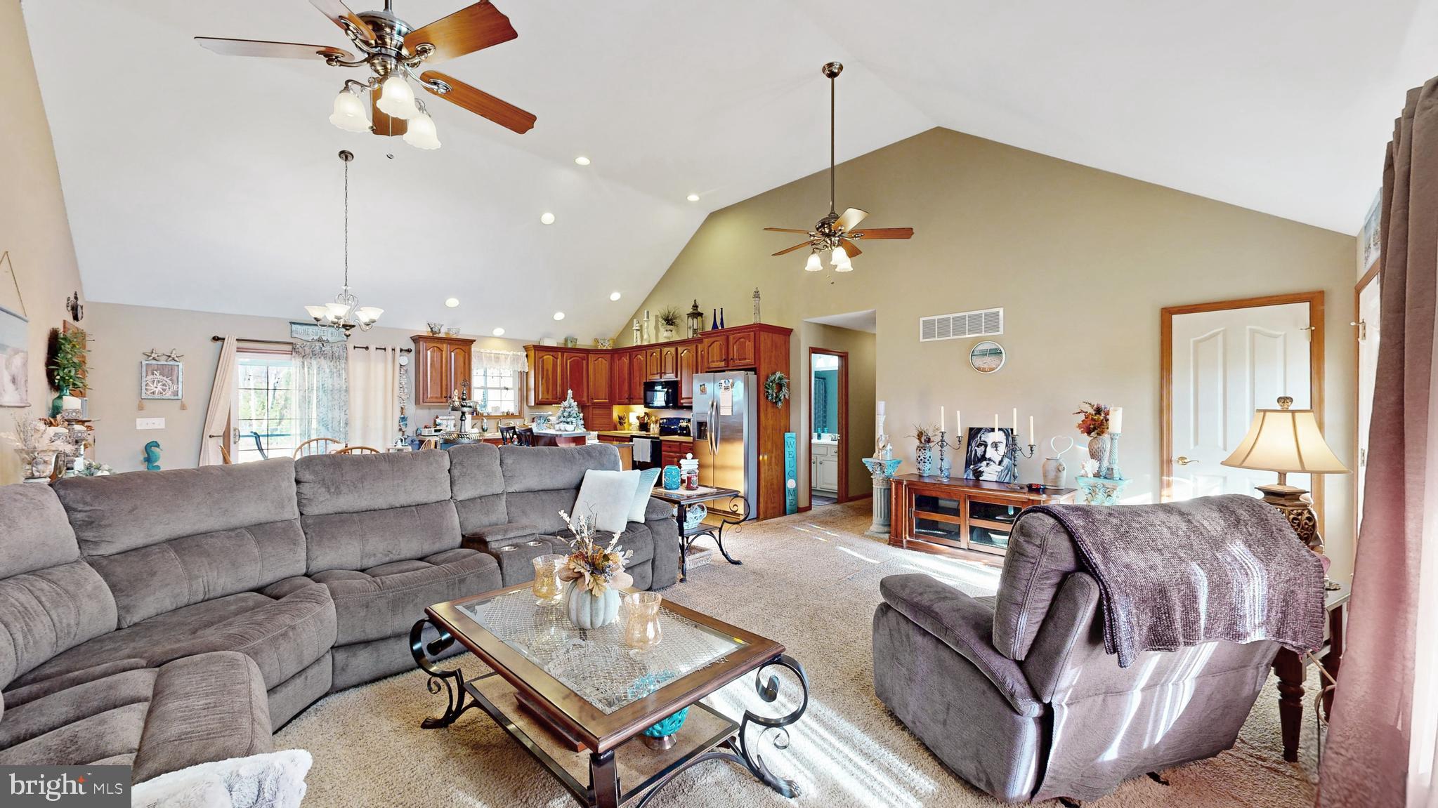 11872 Shawnee Road Greenwood, DE 19950 - Photo 27 of 55 a living room with furniture a chandelier and a chandelier