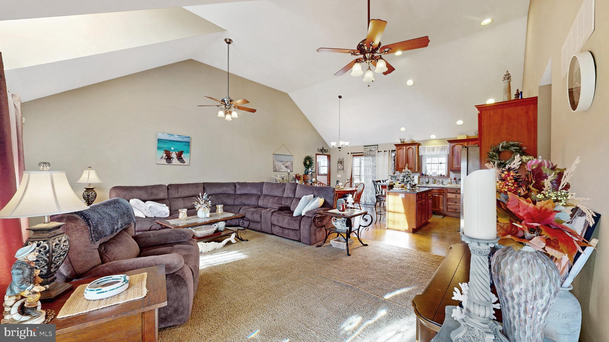 11872 Shawnee Road Greenwood, DE 19950 - Photo 28 of 55 a living room with furniture and a chandelier