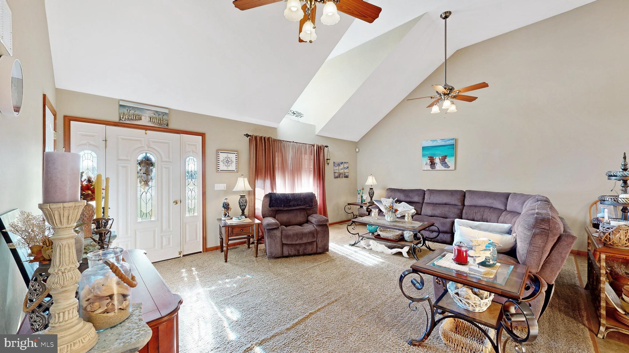 11872 Shawnee Road Greenwood, DE 19950 - Photo 29 of 55 a living room with furniture a rug and gym equipment