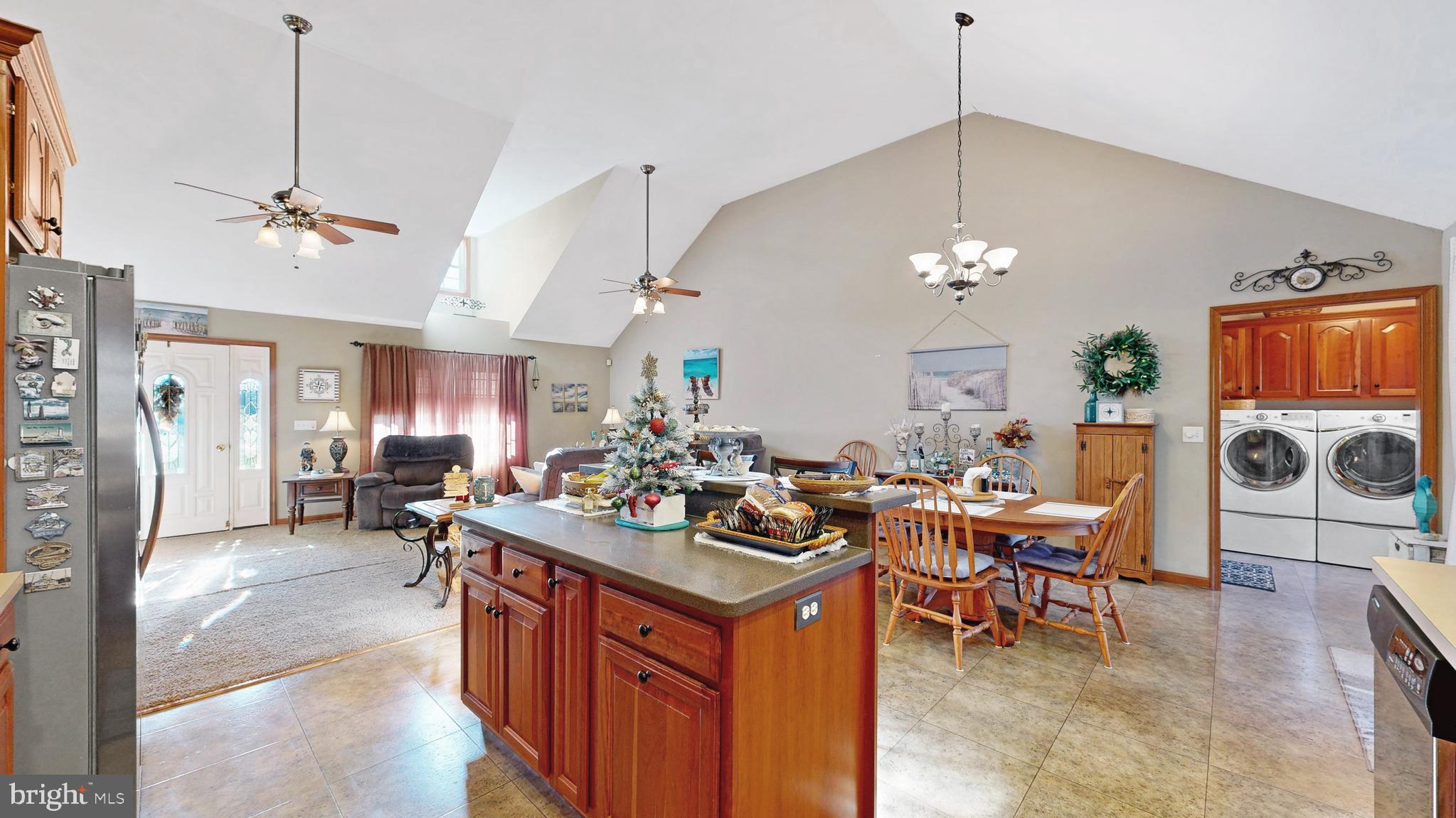 11872 Shawnee Road Greenwood, DE 19950 - Photo 31 of 55 a view of a dining room and livingroom with furniture wooden floor a chandelier and a painting