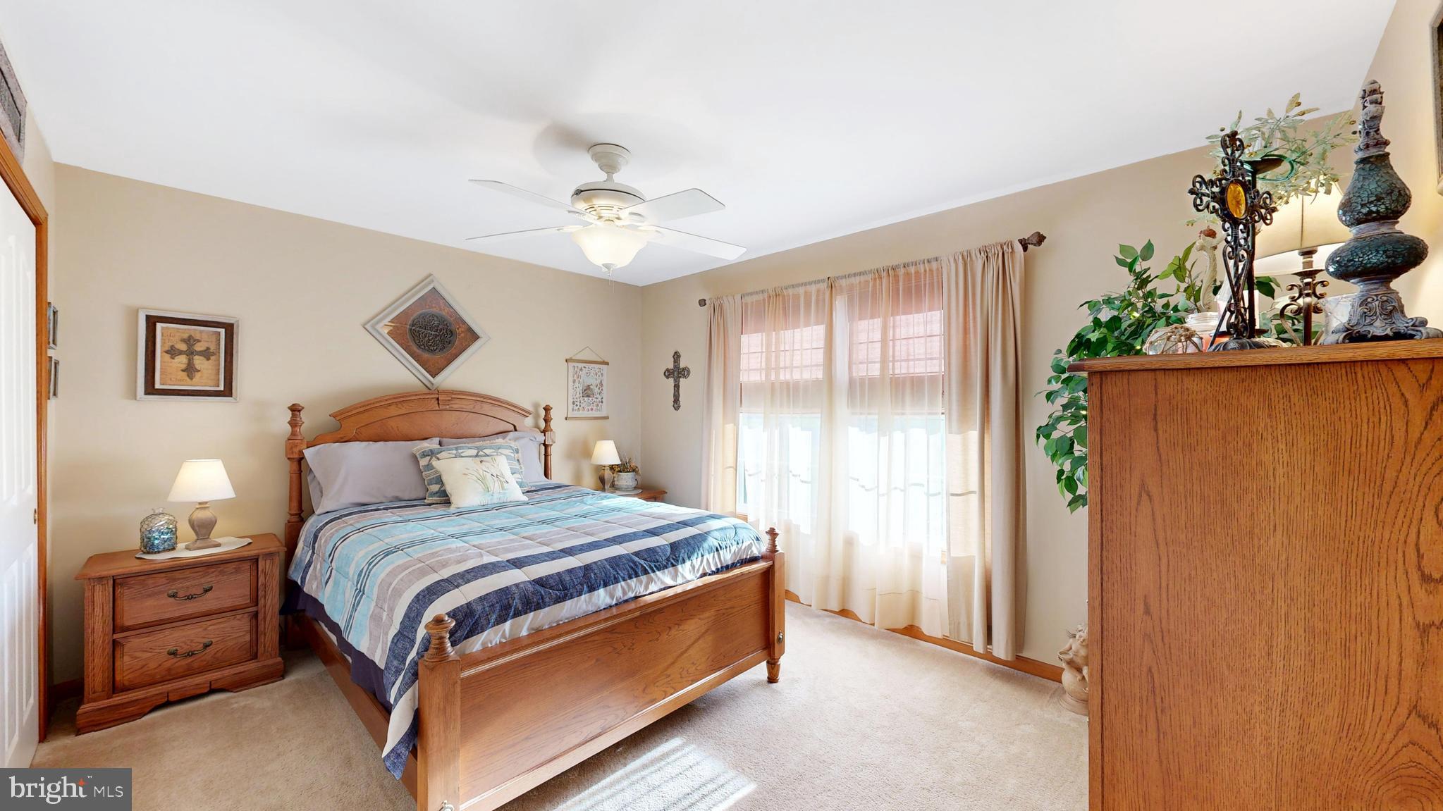 11872 Shawnee Road Greenwood, DE 19950 - Photo 35 of 55 a bedroom with a bed chandelier and a window