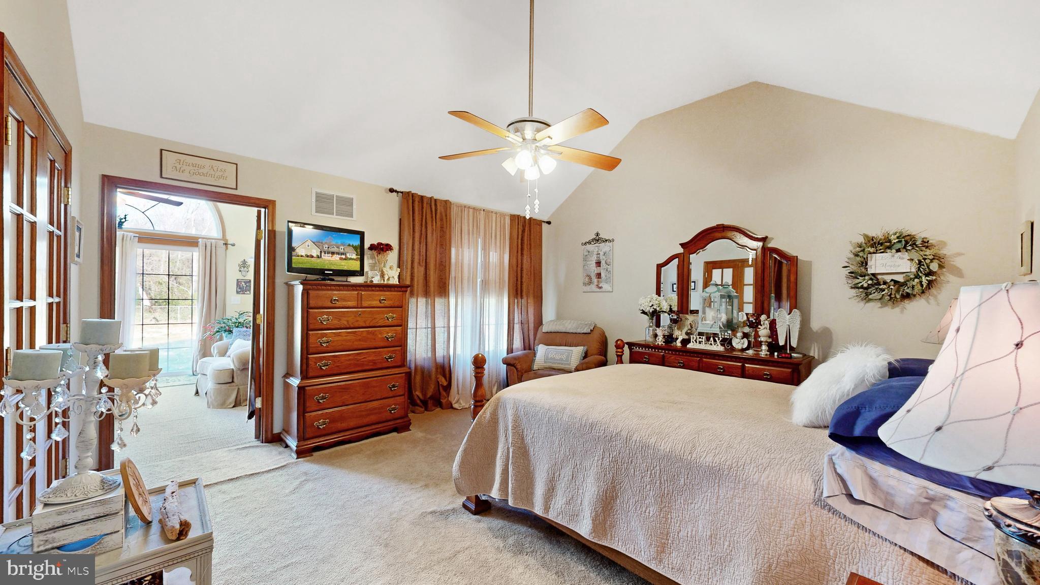 11872 Shawnee Road Greenwood, DE 19950 - Photo 37 of 55 a bedroom with furniture and a chandelier
