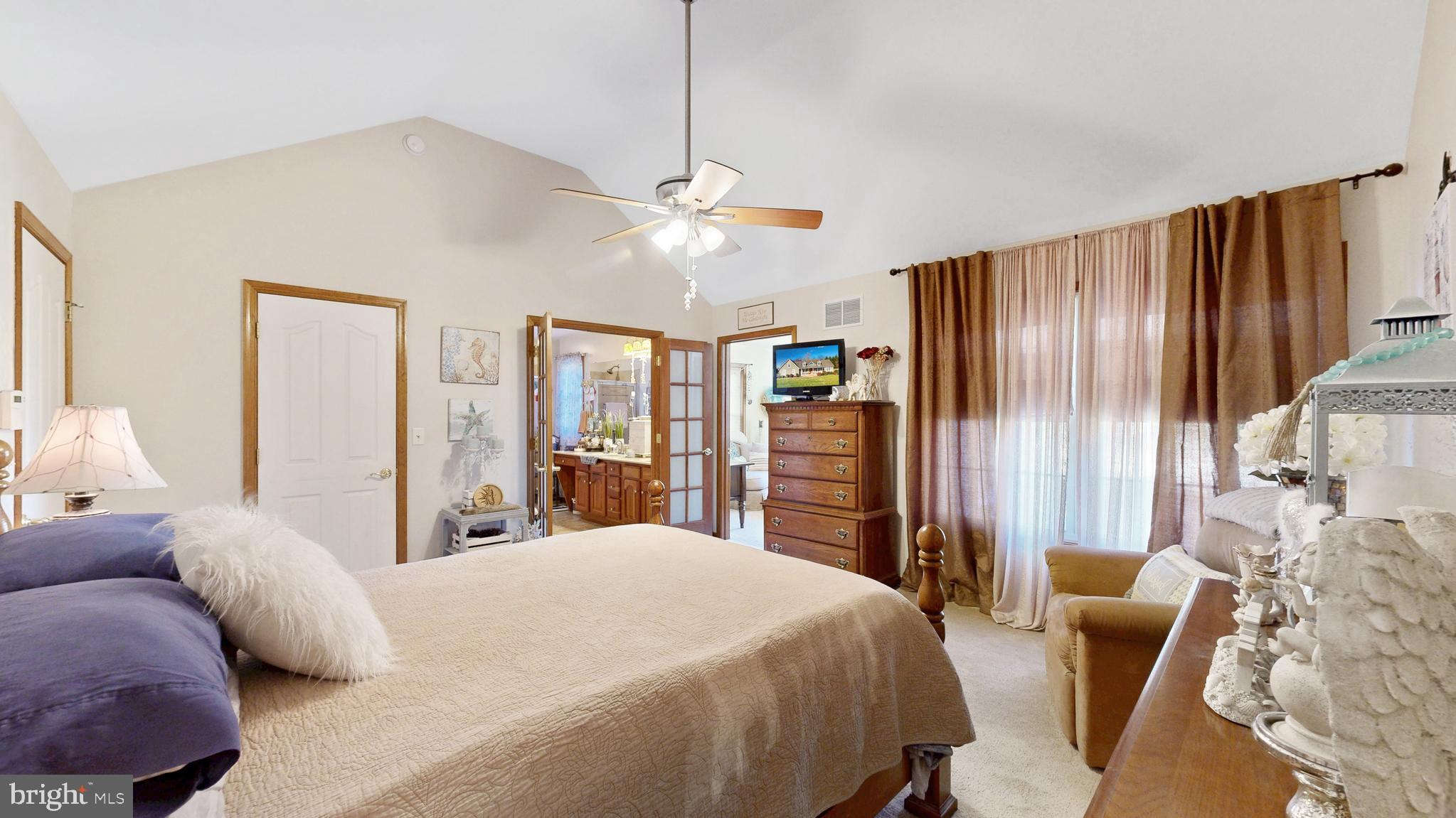 11872 Shawnee Road Greenwood, DE 19950 - Photo 38 of 55 a bedroom with a bed dresser and a large window