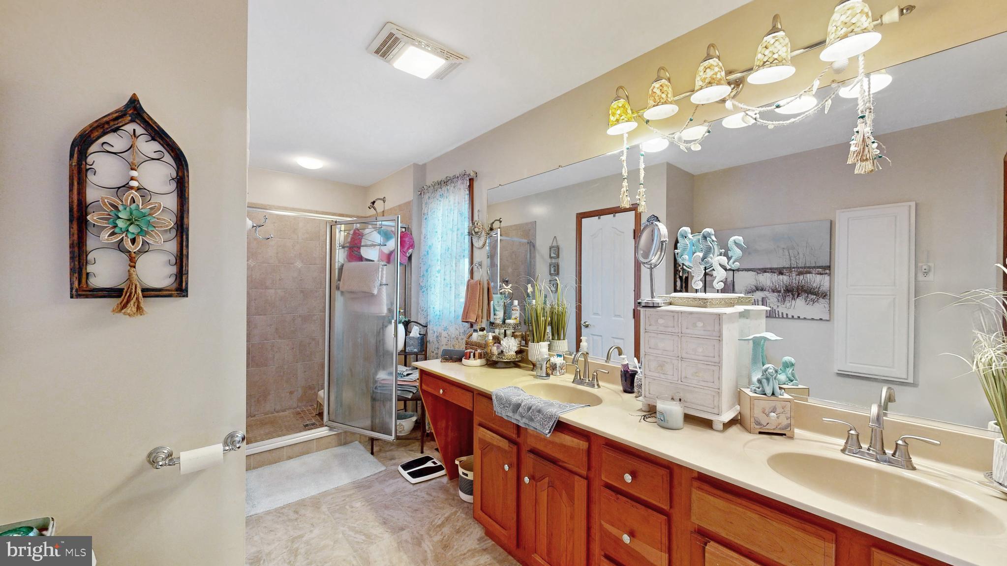 11872 Shawnee Road Greenwood, DE 19950 - Photo 42 of 55 a bathroom with a double vanity sink mirror and