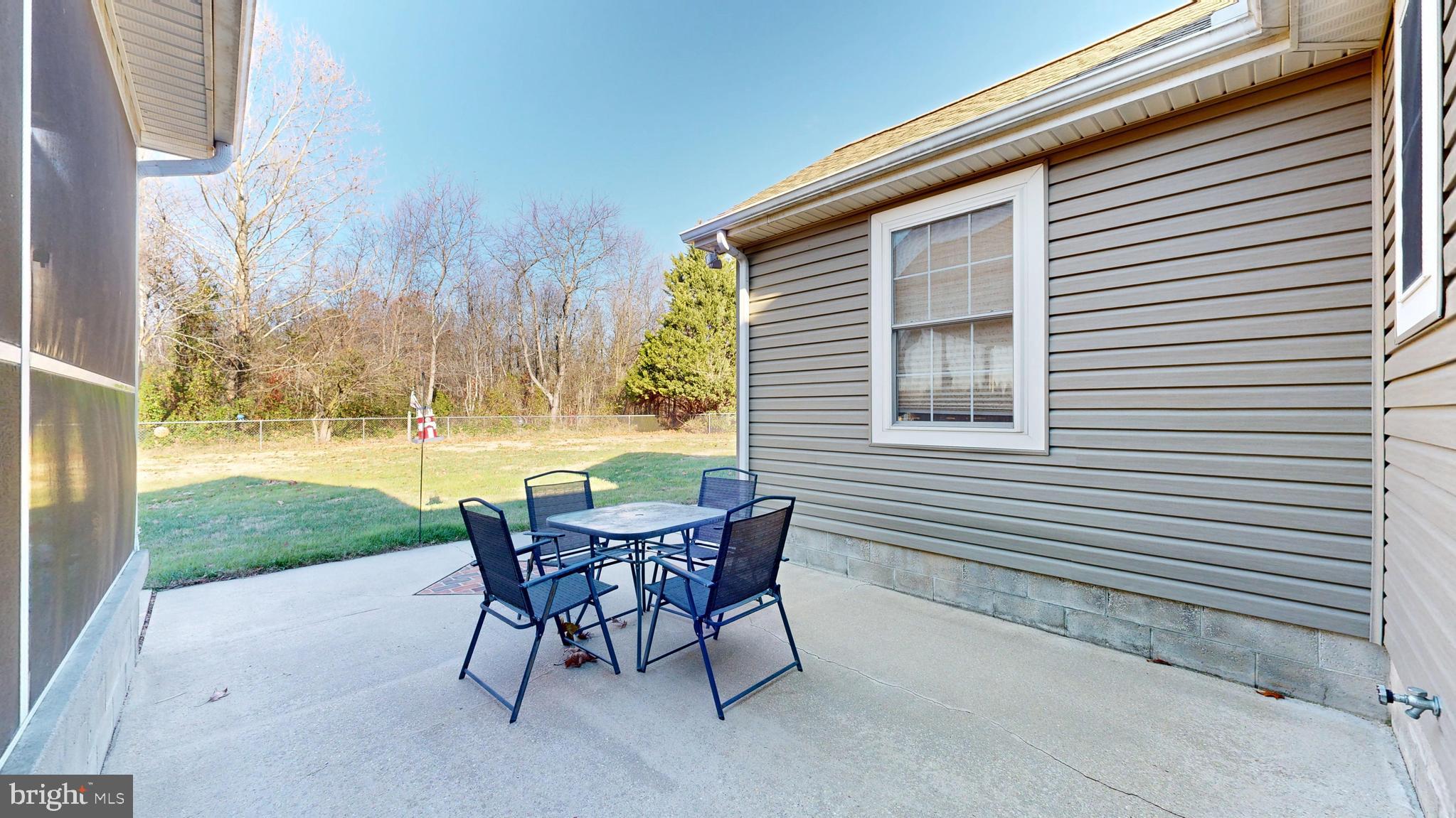 11872 Shawnee Road Greenwood, DE 19950 - Photo 45 of 55 a view of a yard with a table and chairs