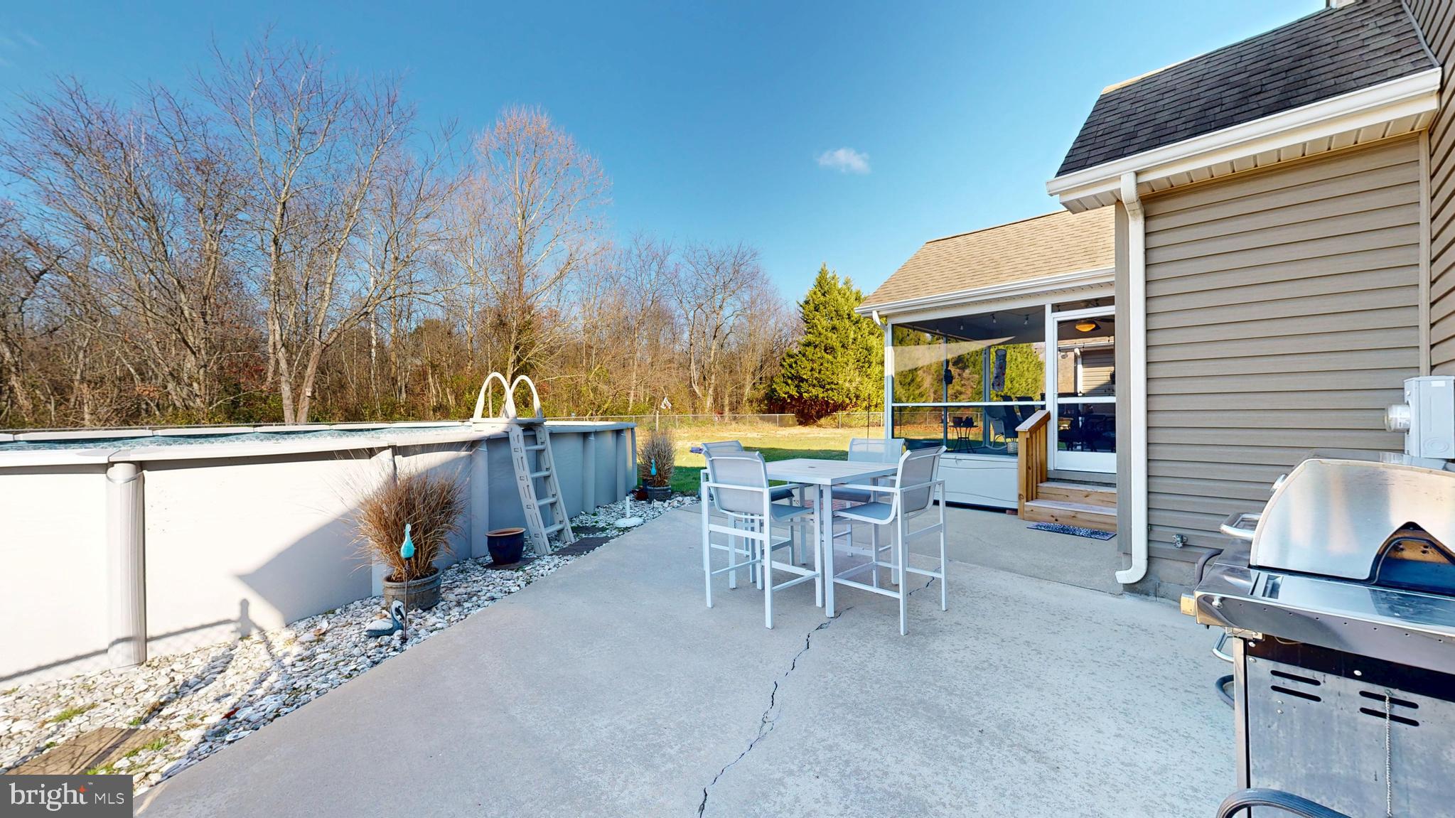 11872 Shawnee Road Greenwood, DE 19950 - Photo 48 of 55 a view of a patio with a table and chairs
