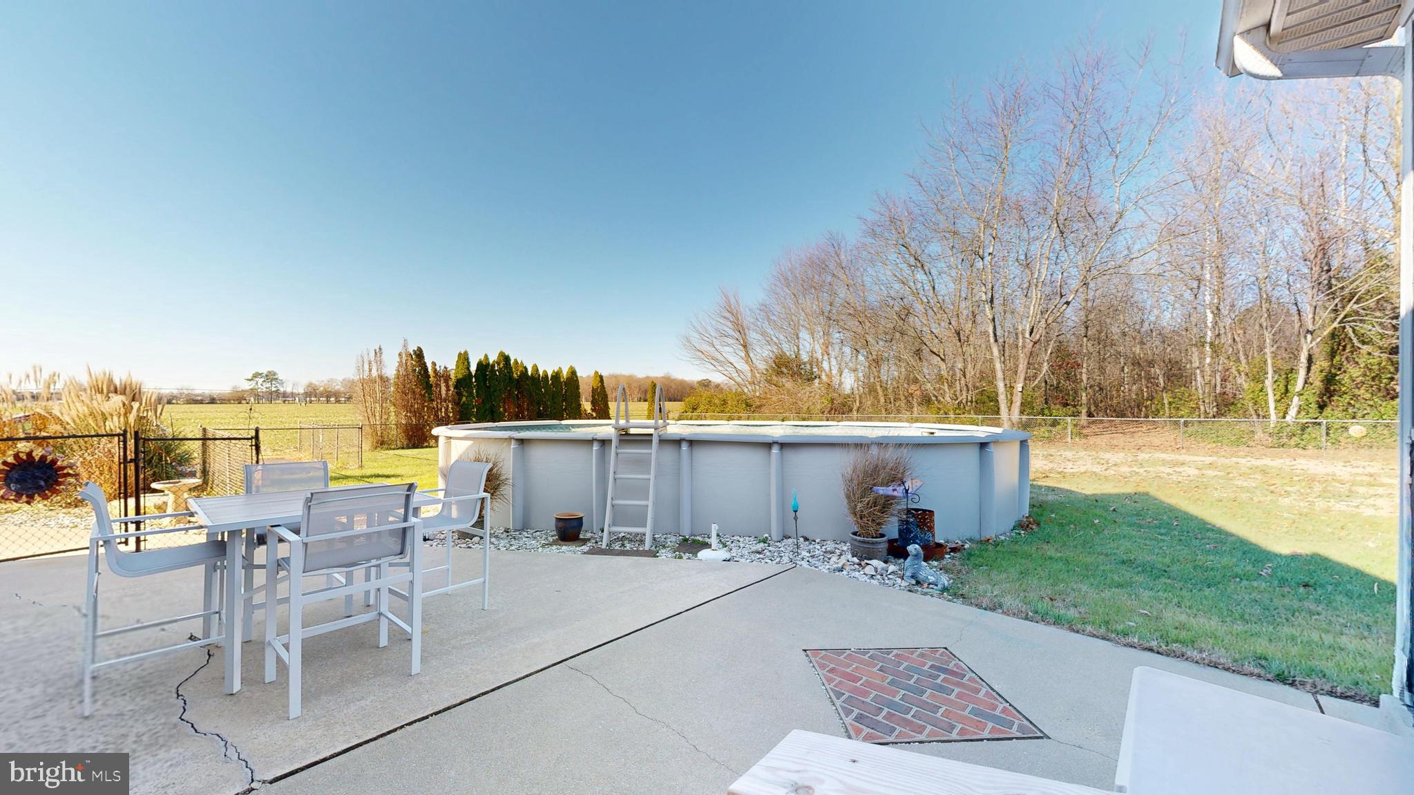 11872 Shawnee Road Greenwood, DE 19950 - Photo 49 of 55 a view of a patio with a table and chairs