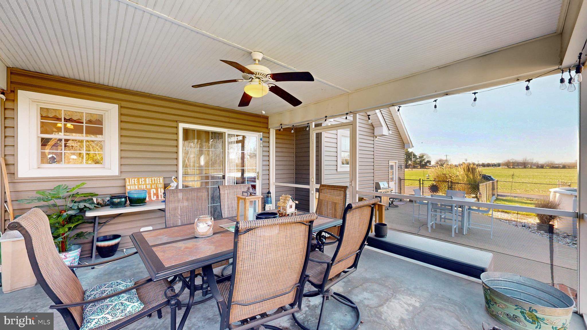 11872 Shawnee Road Greenwood, DE 19950 - Photo 50 of 55 a living room with furniture and floor to ceiling windows