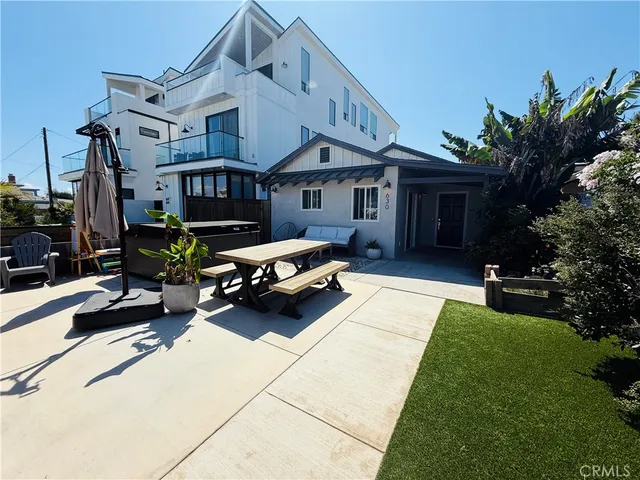 a house view with a sitting space and garden