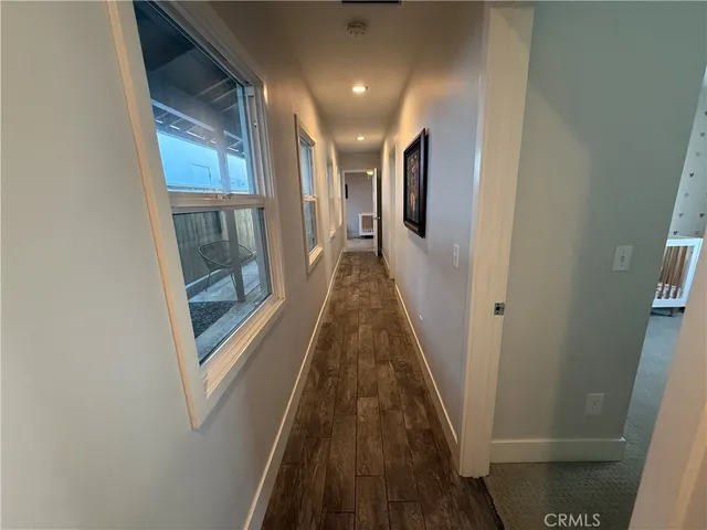 a view of gallery with wooden floor